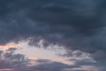 Naklejka na ściany i meble Beautiful dramatic sky with a cloud at sunset