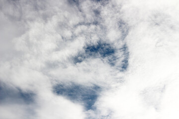 Bright blue sky with white clouds