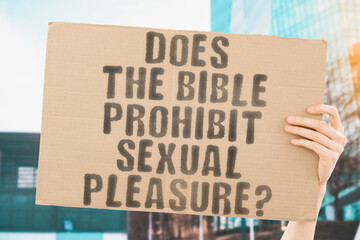 The question " Does the Bible prohibit sexual pleasure? " is on a banner in men's hands with blurred background. Sexual. Ecstasy. Girlfriend. Intimacy. Erotic. Evil. Figure. Sin. Biblical. Christ. Bed