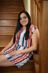 beautiful portrait of a woman on wooden stairs