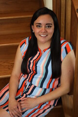 beautiful portrait of a woman on wooden stairs