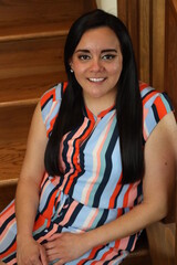 beautiful portrait of a woman on wooden stairs