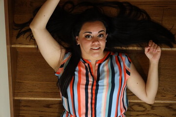 beautiful portrait of a woman on wooden stairs