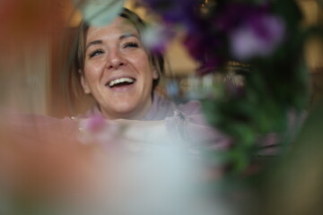 floral portrait of a cheerful woman