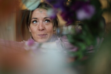 floral portrait of a cheerful woman