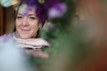 floral portrait of a cheerful woman