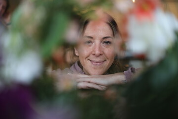 floral portrait of a cheerful woman