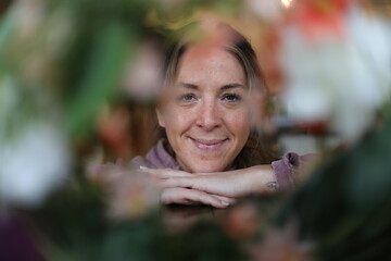 floral portrait of a cheerful woman