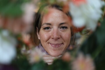 floral portrait of a cheerful woman