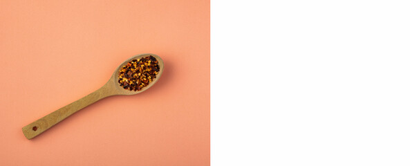 crushed red chillies in wooden spoon - healthy food