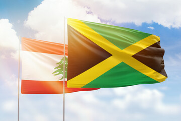 Sunny blue sky and flags of jamaica and lebanon