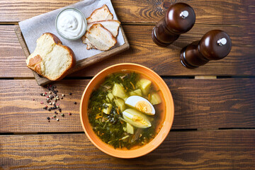 broth with egg and bread with sour cream