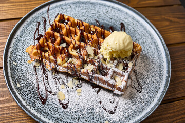 Belgian waffle with ice cream close