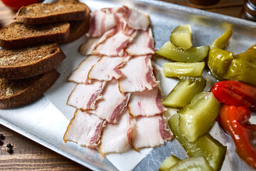 A set of lard of black bread and pickles