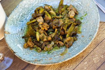 Fototapeta na wymiar Lechecillas de ternasco, Aragonese dish made of lamb's glands, served on plate in restaurant.