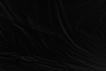 Black fabric texture for background; Abstract black fabric cloth wave or wavy folds texture...