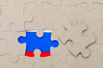 The missing piece of the puzzle and the flag of Russia in the frame. Background with copy space