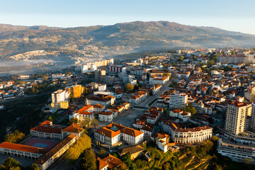 Picturesque drone view of Vila Real cityscape in valley framed by Serra do Alvao and Serras do...