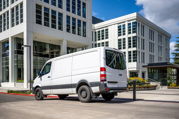 Compact cargo mini van delivered goods to multilevel urban apartments city neighborhood