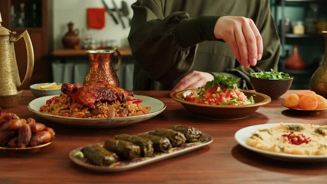 Kabsa, maqluba, dolma, tabbouleh close-up, rice and meat dish, middle eastern national traditional food. Muslim family dinner, Ramadan, iftar. Arabian cuisine.