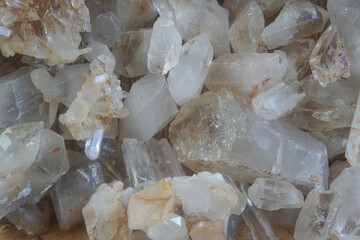 Raw crystal white quartz gemstone rocks. It has a hardness of 7 on the Mohs scale of mineral hardness.