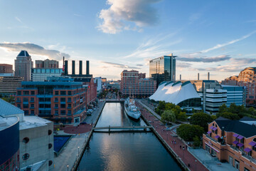 Aerial Drone View of Baltimore City Inner Harbor before Sunset with Blue Skies