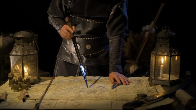 Developing sword fighting strategy on the map.
The commander works on the general plans of the war on the historical map.
