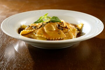 Beef ravioli with herb sauce