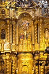 Fototapeta na wymiar Altar in the Church of la Compania de Jesus, or the Gold Church, in the Old Town Quito, Ecuador