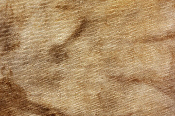Old fabric with brown stains full frame for background, murder case idea, old blood stains on fabric,cream brown abstract