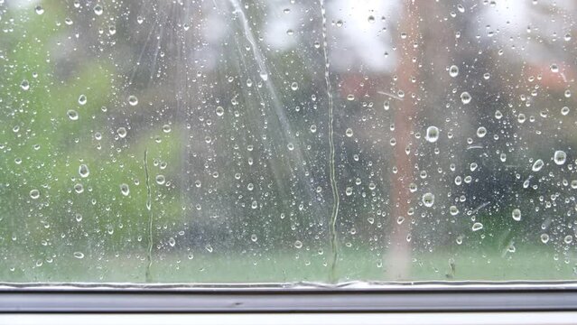 Raindrops Falling On Window Sill During Rainstorm In Calgary