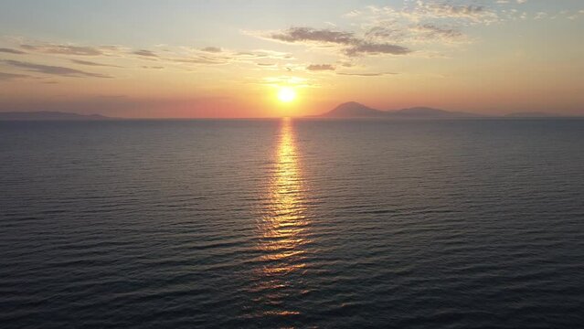 Beautiful sunset in Greece. Flying into the sunset. View to island of Kefalonia
