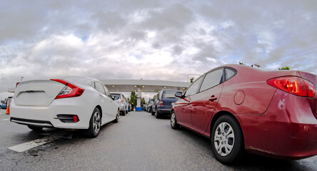 Cars waiting in line at the gas pump