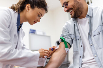 Preparation for blood test by female doctor medical uniform on the table in white bright room....