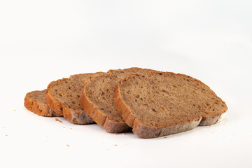 Slices grain bread isolated on bright background. Close up view.