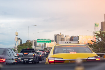 Bangkok, Thailand - May 10, 2022 : Taxi in Traffic jam on toll way, Bangkok, Thailand. Selective focus.