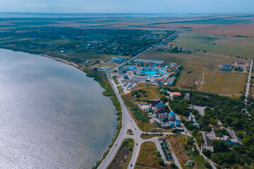 Top view of hotel-type houses on the coast of the Sea of ​​Azov. Rest on the seashore. Resort place. "Fedotov braid". located in Kyrylivka in southern Ukraine