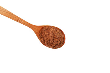 Bird cherry flour in brown wooden spoon on white background, close-up.  Design element. Shredded berry Bird cherry use in baking and healthy smoothie