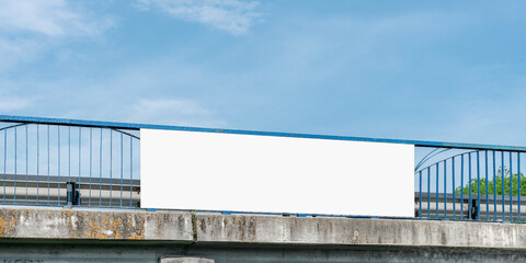 Empty white poster with mock up space fixed on rusty bridge banister outdoor