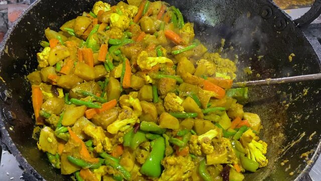 MIX VEGETABLE CURRY- Indian recipe, mixed veg containing Carrots, cauliflower, green peas and beans with traditional masala and curry.