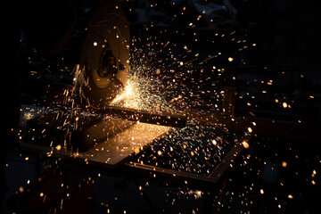 Sparks from metal. Lots of sparks from grinding steel.