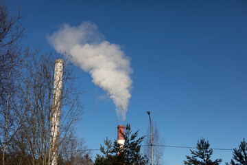 Smoke from chimney. Industrial zone. Operation of boiler house.