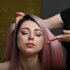 Naklejka premium Photo hairdresser hands and model doing hairstyle