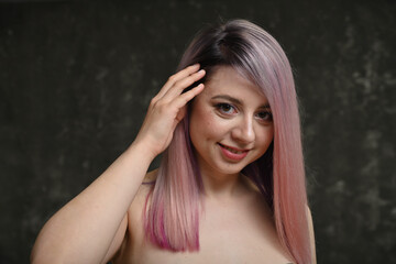 Fototapeta premium portrait of a blonde woman with dyed hair with a smile