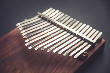 Traditional wooden kalimba isolated on black