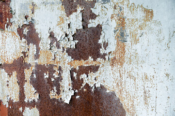 Rusty surface with old paint residue. Rusty metal surface as background image.