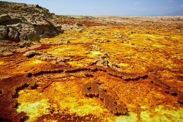 Fototapeta na wymiar Multicolored pools of iron oxides erupting from the depths of the Dallol volcano, Danakil, Afar Region, Ethiopia