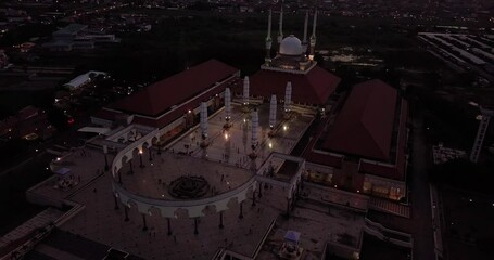 drone shot looking down at the Grand Mosque Central Java in the center of semarang city central java indonesia wide view at sunset