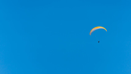 paragliding in the blue sky. High quality photo