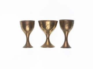 ancient copper goblet for wine on a white background